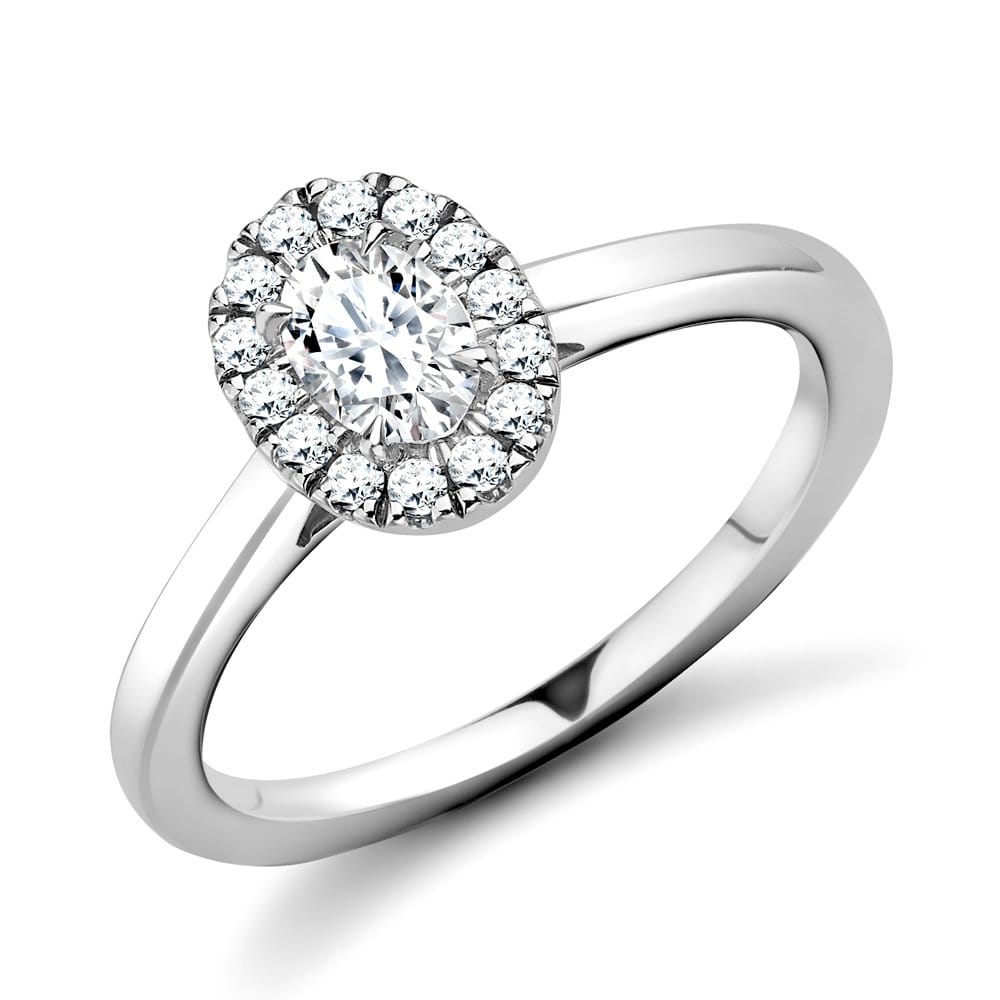 Platinum Oval Diamond With A Halo Surround Engagement Ring