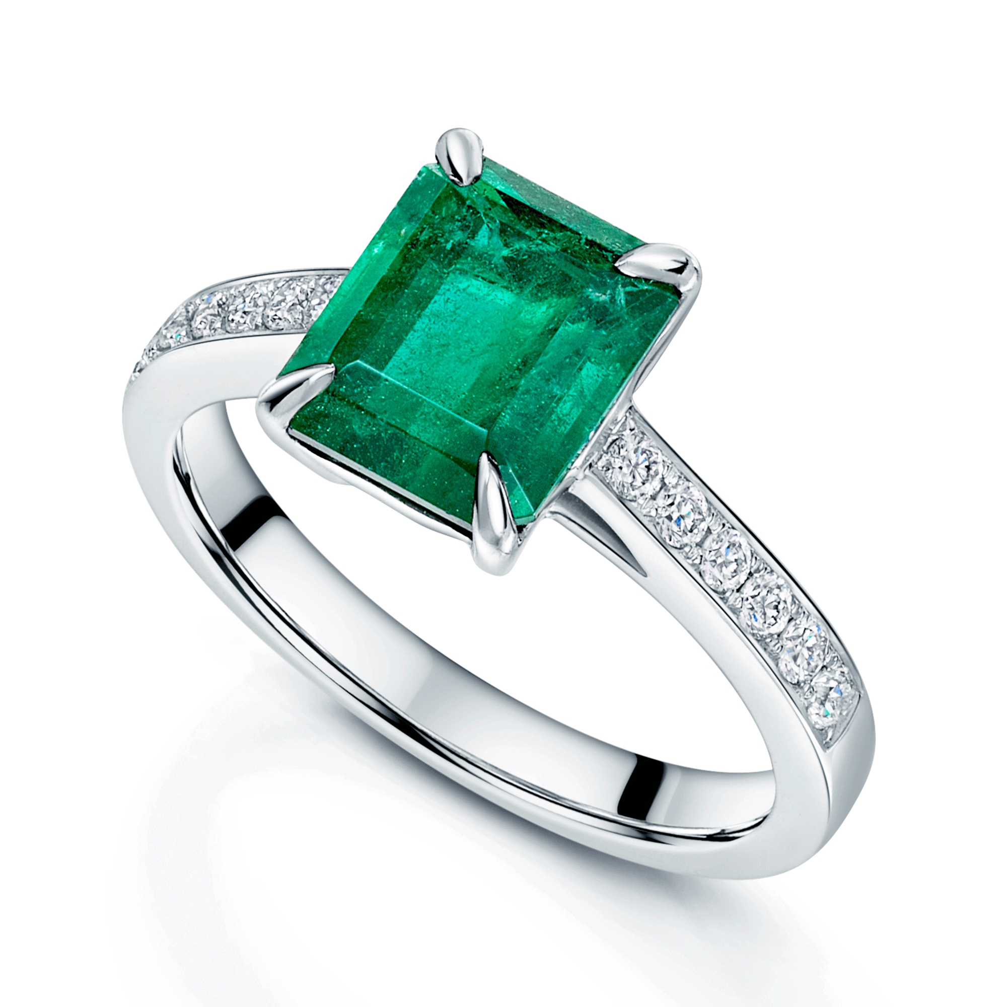 Platinum Emerald Cut Emerald Ring With Diamond Shoulders.