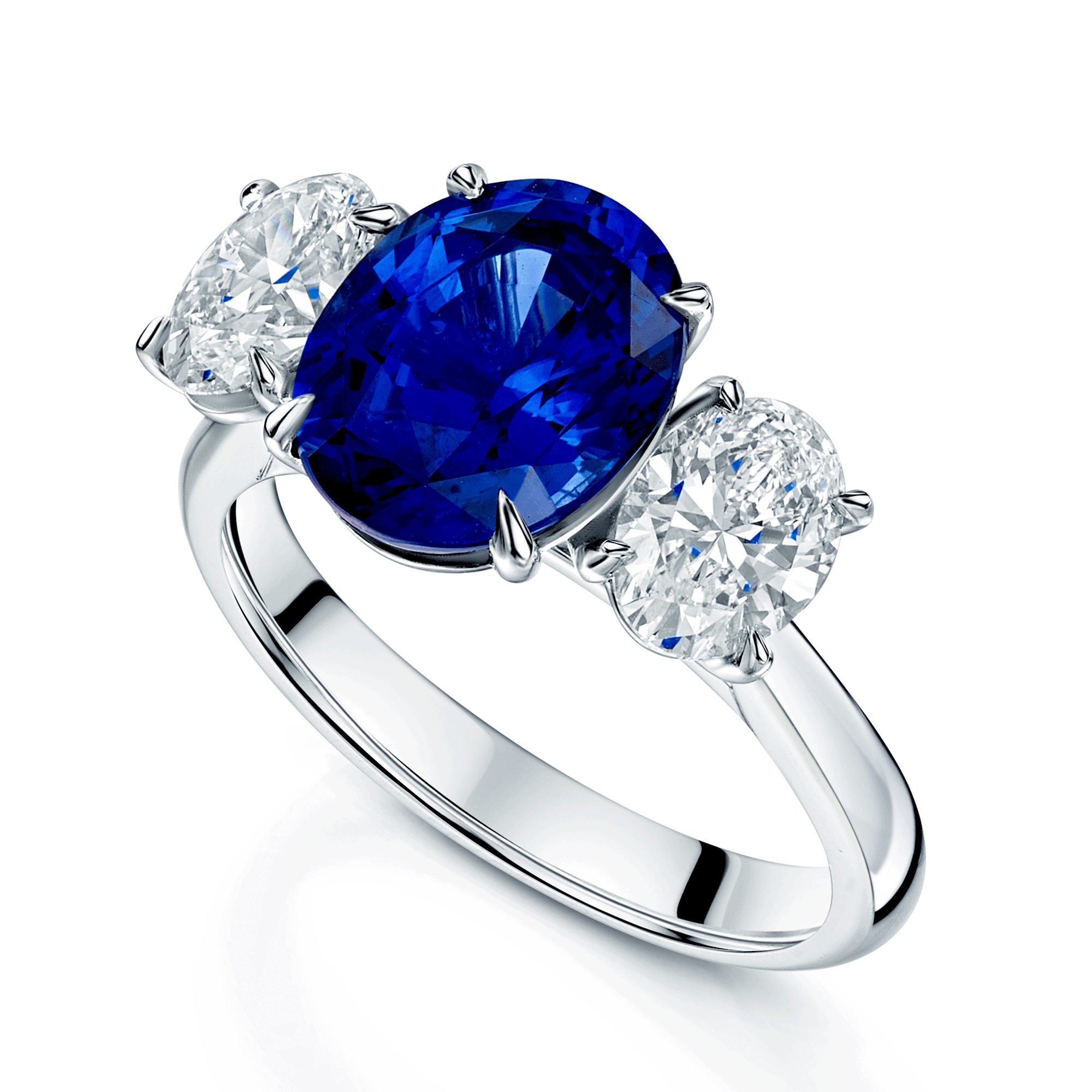 Platinum Oval Cut Sapphire And Diamond Three Stone Ring