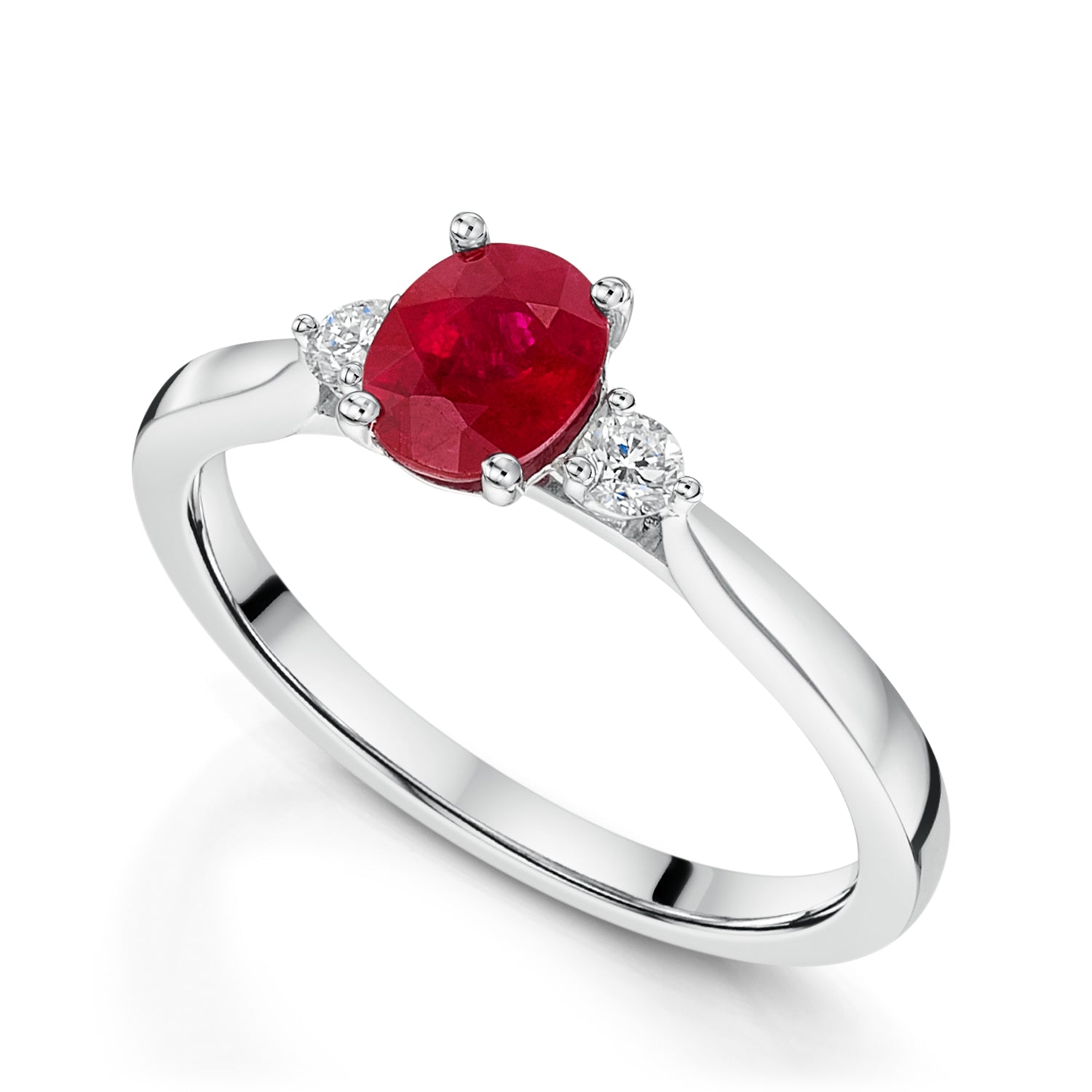 Platinum Oval Ruby Three Stone Ring With Two Round Brilliant Cut Diamonds