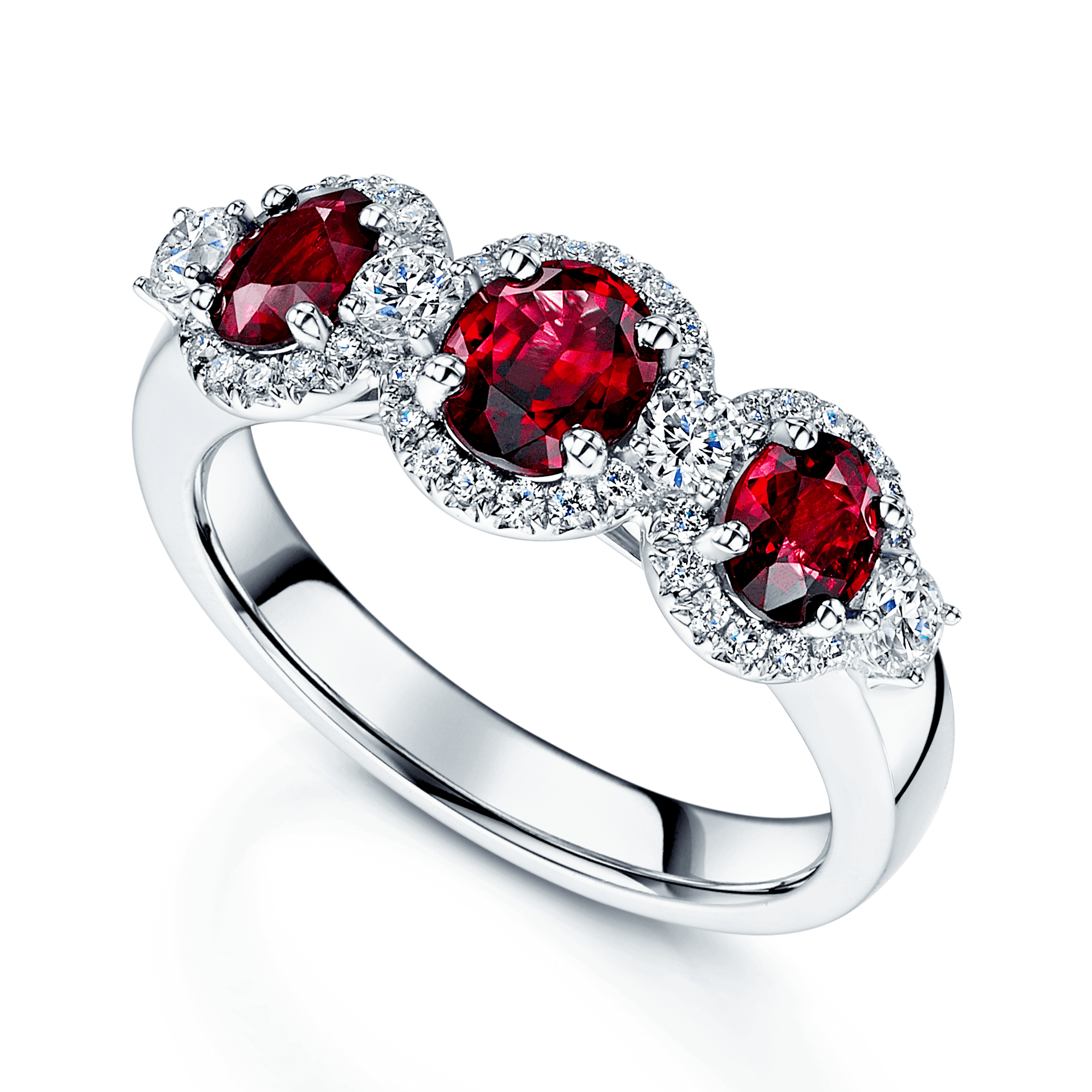 Platinum Round Brilliant Ruby Fancy Three Stone Ring With A Diamond Halo Surround