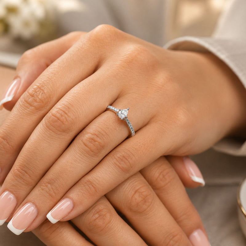 Platinum GIA Pear Cut Diamond Ring with Diamond Set Shoulders