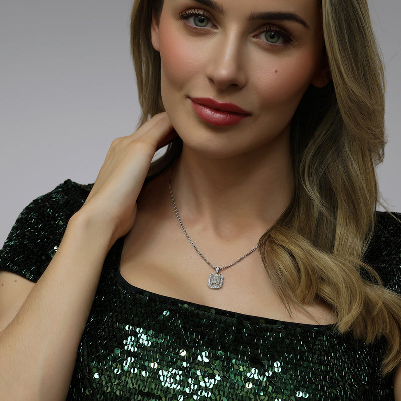 18ct White Gold GIA Certificated Emerald Cut Diamond Pendant With a Grain Set Diamond Halo Frame And A Diamond Bale