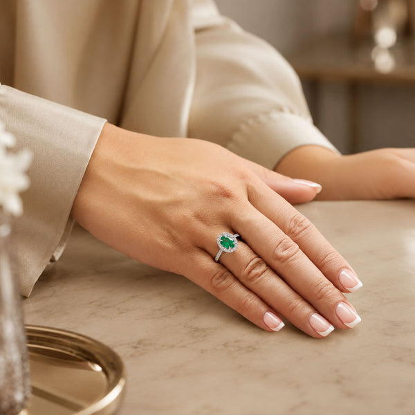 Platinum Oval Cut Emerald And Dimond Ring With Diamond Shoulders