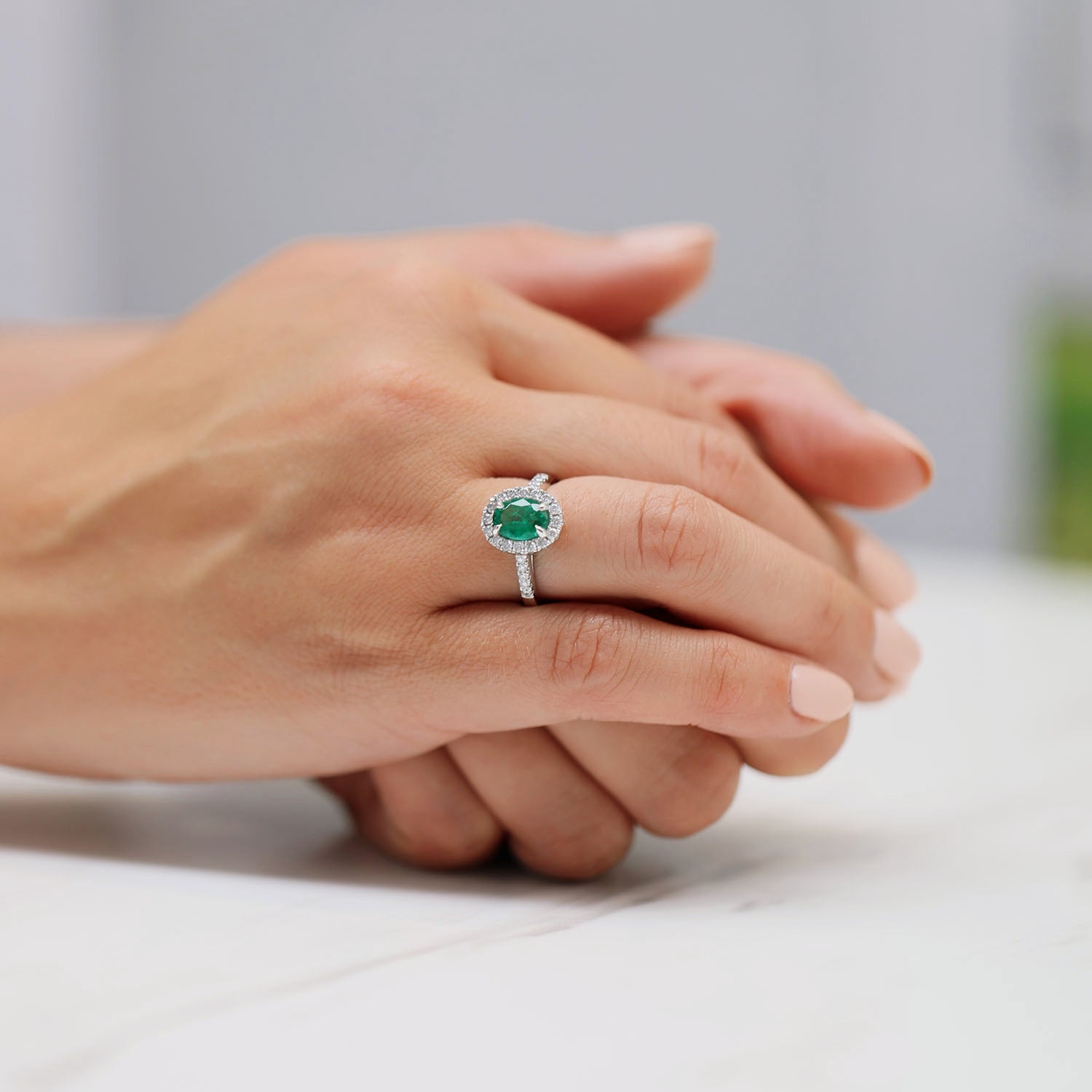 Berry's Platinum Oval Cut Emerald And Dimond Ring With Diamond Shoulders - Berry's Jewellers