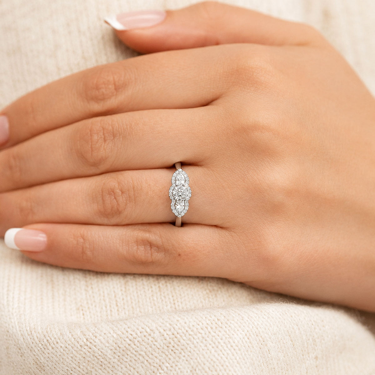 Platinum GIA Certificated Round Brilliant cut and Pear Cut Diamond Halo Three Stone Ring