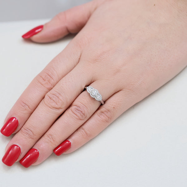 Berry's Platinum GIA Certificated Round Brilliant cut and Pear Cut Diamond Halo Three Stone Ring - Berry's Jewellers