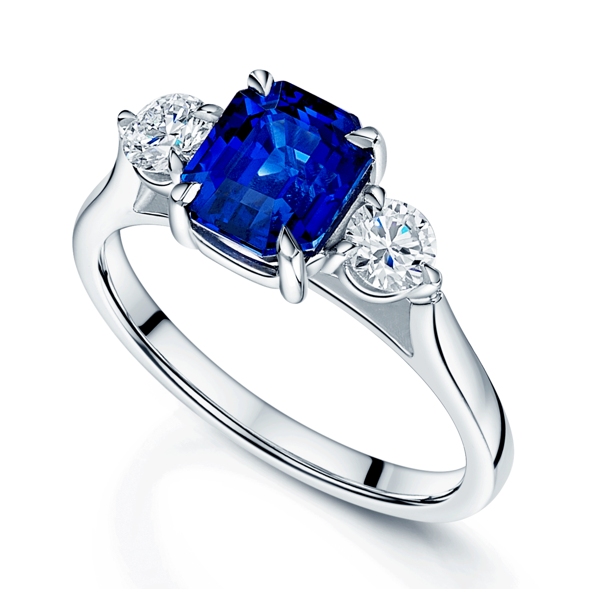 Platinum Rectangular Step Cut Sapphire & Round Brilliant Cut Diamond Three Stone Ring