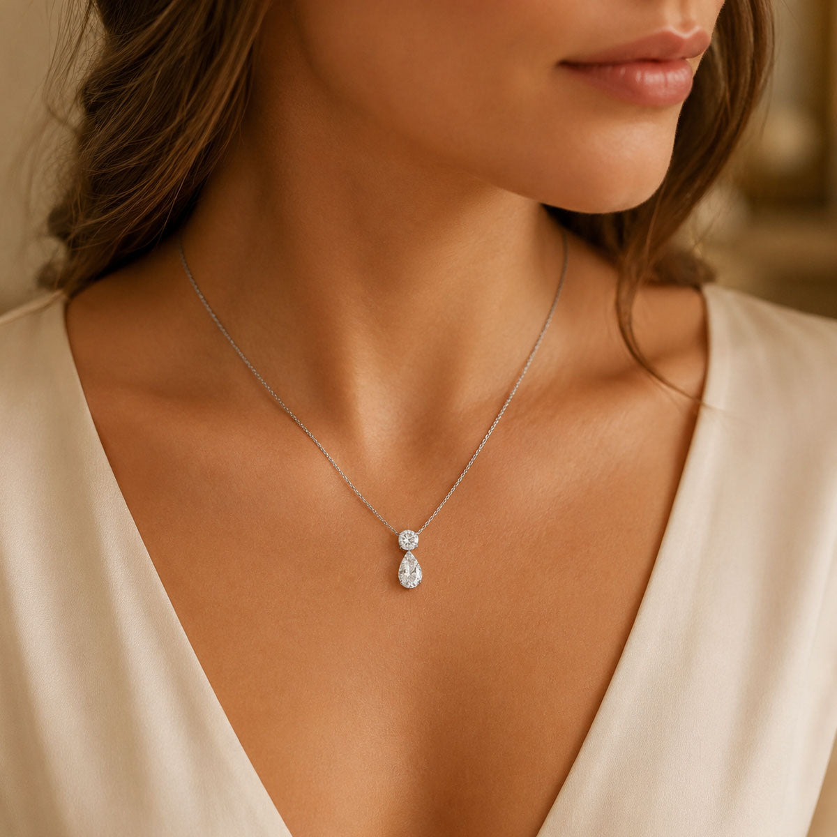 18ct White Gold Pear Cut And Round Brilliant Cut Diamond Drop Pendant