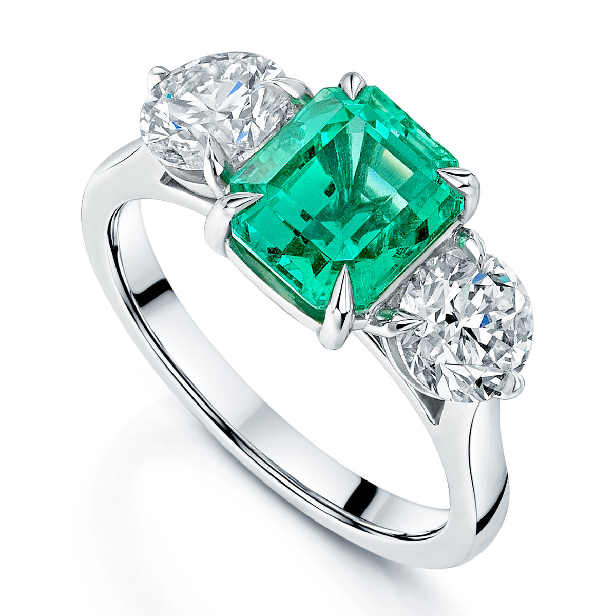 Platinum Emerald And Diamond Three Stone Ring