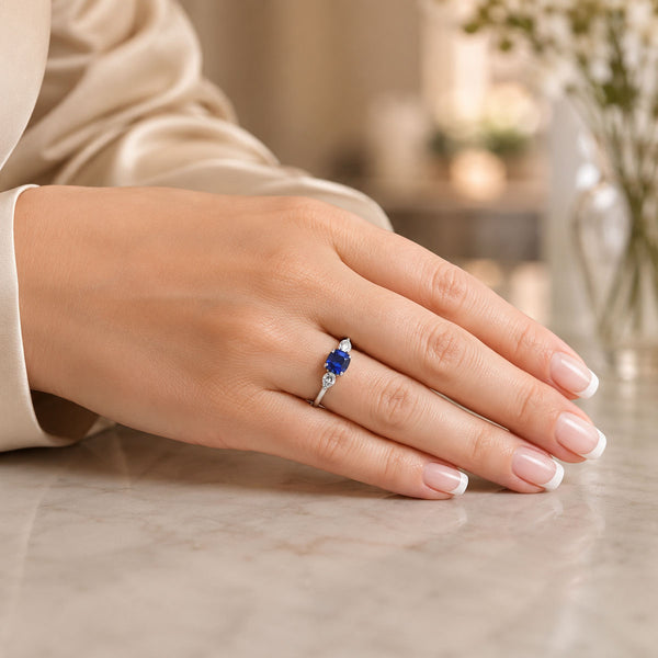 Platinum Cushion Cut Blue Sapphire & Pear Cut Diamond Three Stone Ring