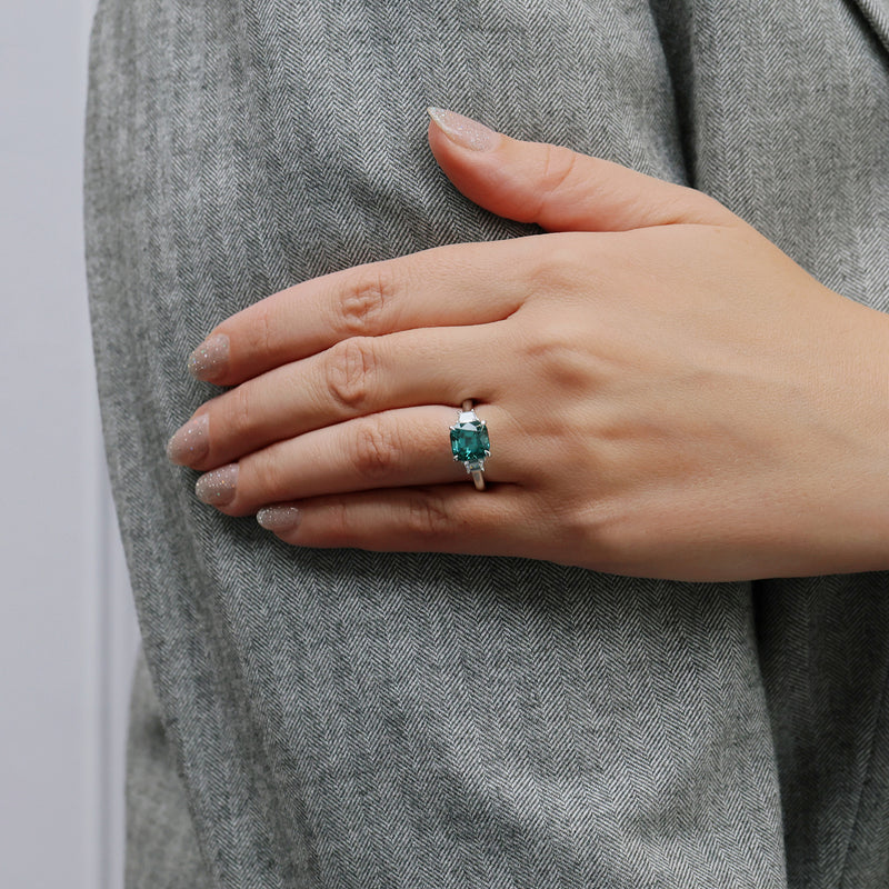 Berry's Platinum Cushion Cut Indicolite Tourmaline And Trapeze Cut Diamond Three Stone Ring - Berry's Jewellers