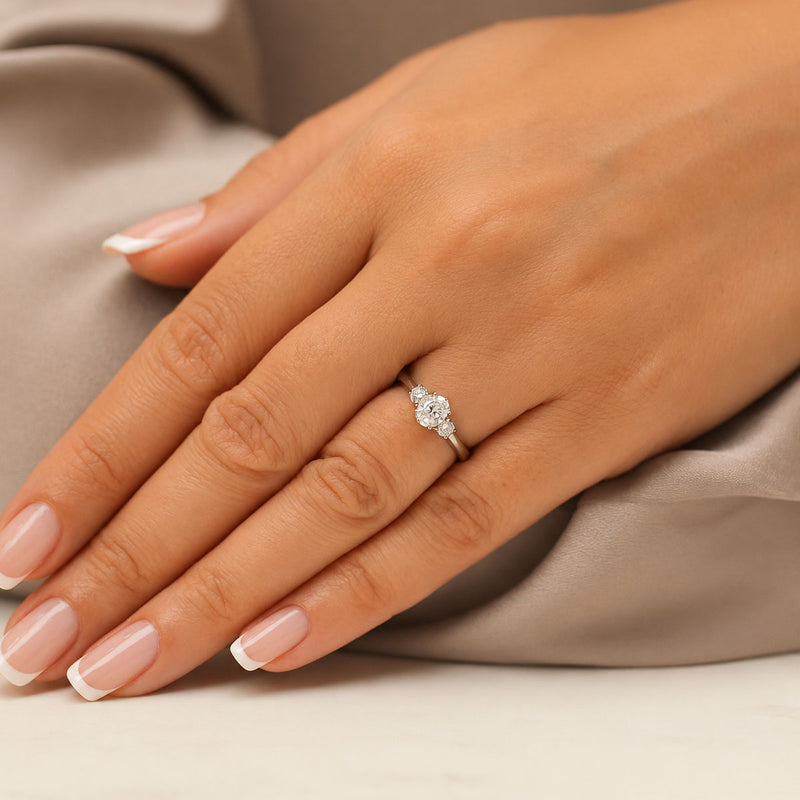 Platinum Oval & Round Brilliant Cut Diamond Three Stone Ring