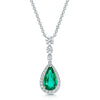 18ct White Gold Pear Cut Emerald And Diamond Graduated Halo Pendant