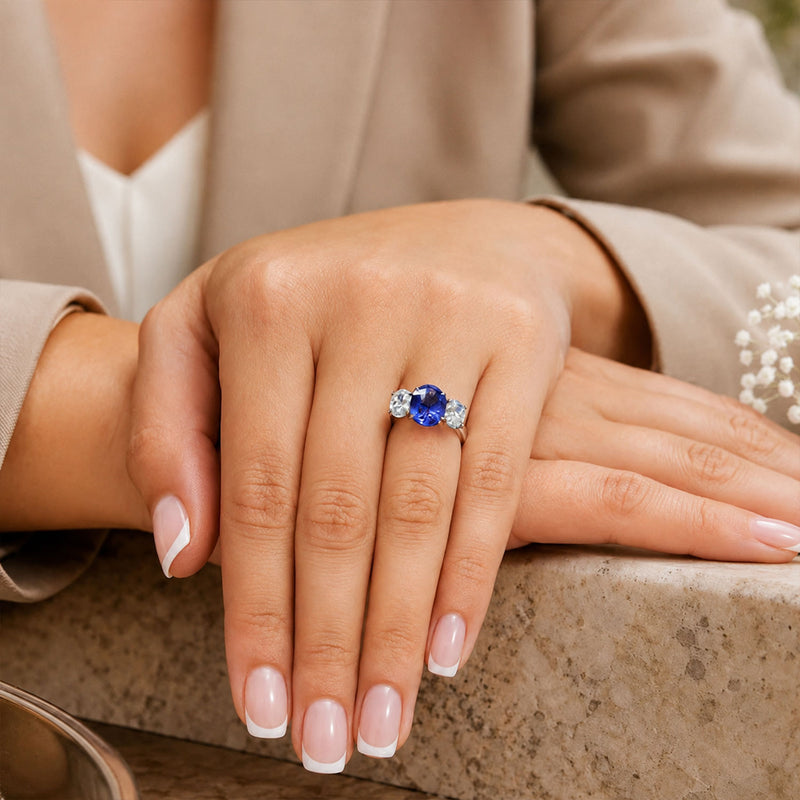 Platinum Oval Cut Sapphire And Diamond Three Stone Ring