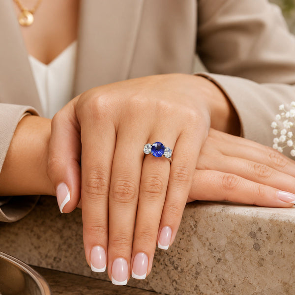 Platinum Oval Cut Sapphire And Diamond Three Stone Ring