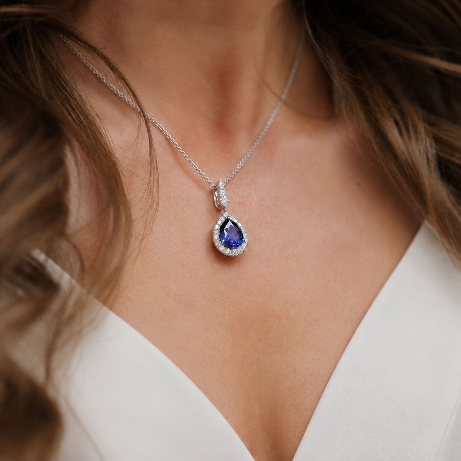 Berry's 18ct White Gold Pear Cut Sapphire And Diamond Halo Pendant - Berry's Jewellers