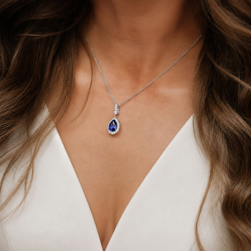 Berry's 18ct White Gold Pear Cut Sapphire And Diamond Halo Pendant - Berry's Jewellers