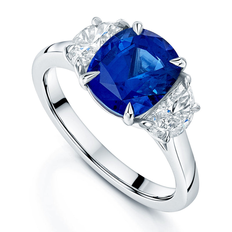 Platinum Cushion Cut Sapphire And Half Moon Cut Diamond Three Stone Ring