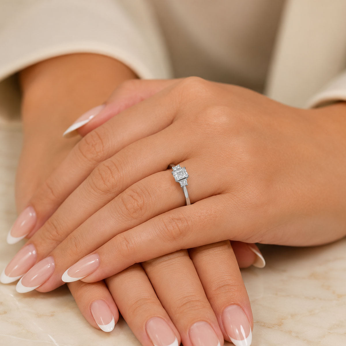 Platinum GIA Emerald Cut Diamond With Two Trilliant Cut Diamonds Trilogy Ring