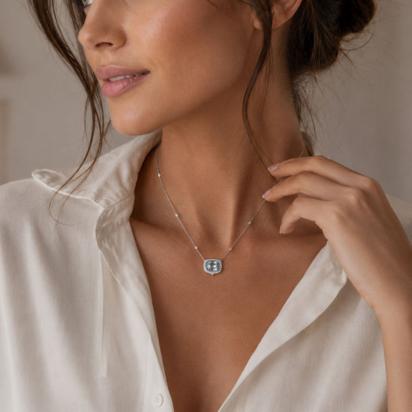 Berry's 18ct White Gold Aquamarine And Diamond Oval Cut Halo Pendant - Berry's Jewellers