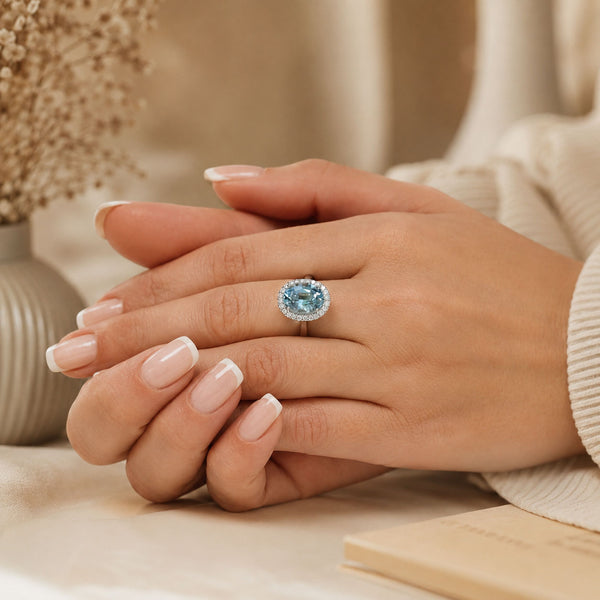Platinum Oval Aquamarine And Diamond Halo Ring