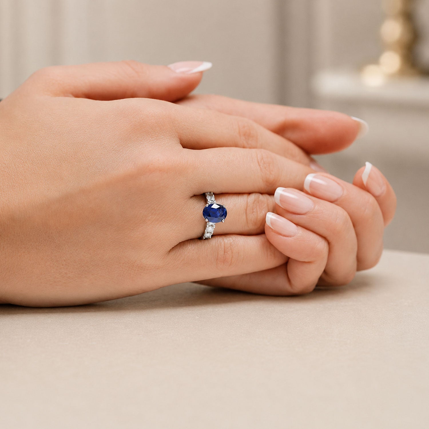 Platinum Oval Sapphire Dress Ring With Diamond Shoulders