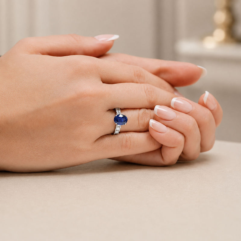 Platinum Oval Sapphire Dress Ring With Diamond Shoulders