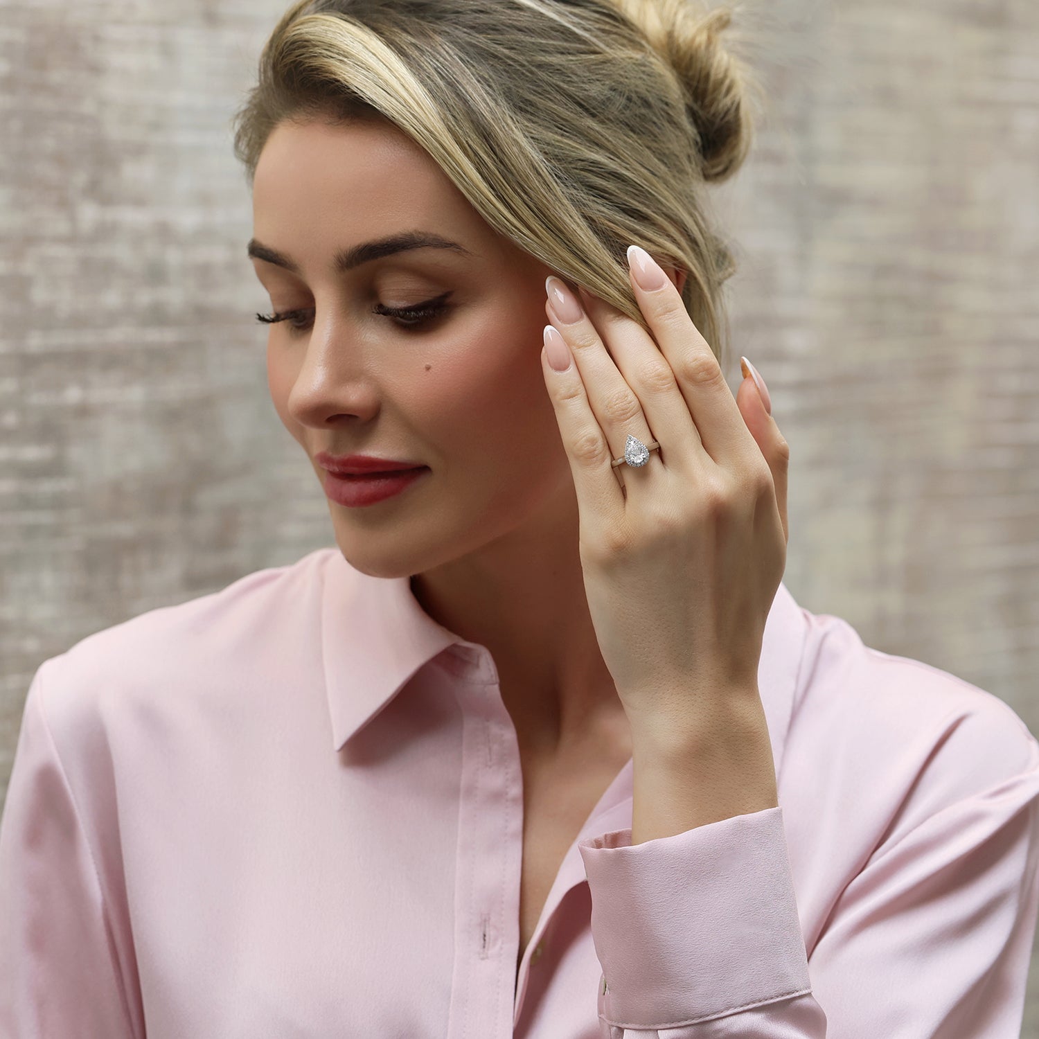 Platinum Pear Cut Diamond Engagement Ring With Diamond Set Shoulders