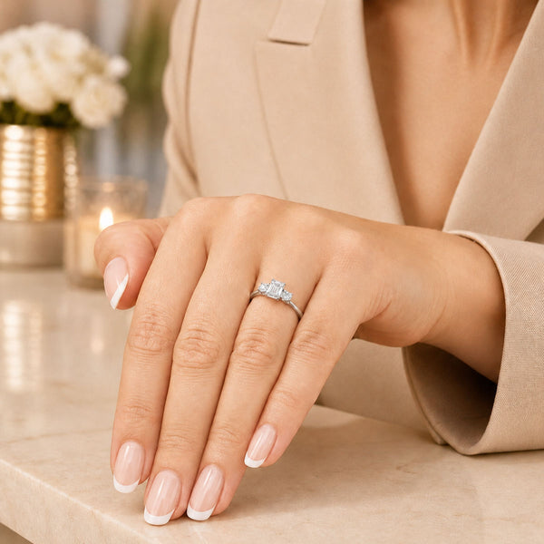 Platinum Emerald Cut And Round Brilliant Cut Diamond Three Stone Ring