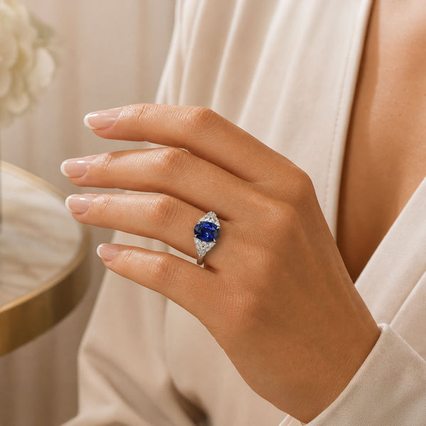 18ct White Gold Oval Cut Blue Sapphire And Diamond Shoulder Dress Ring
