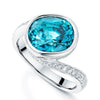 Platinum Oval Blue Zircon and Diamond Twist Ring
