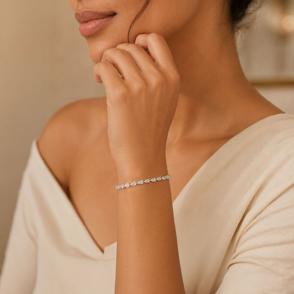 Platinum Pear Cut Diamond Claw Set Tennis Bracelet