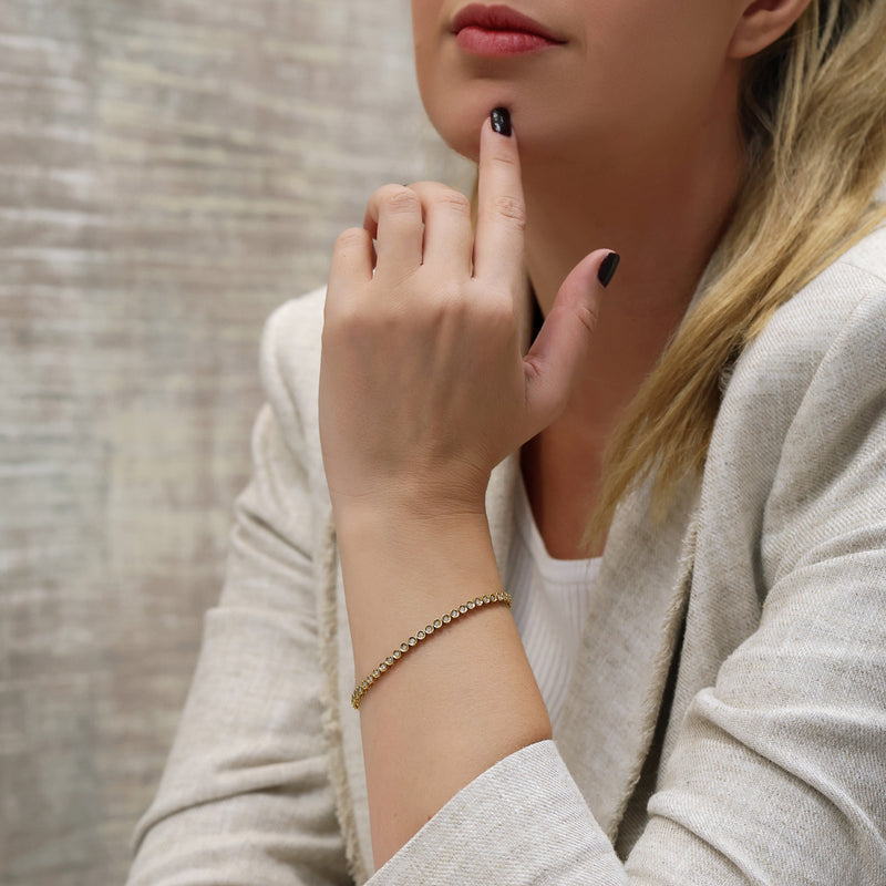 Berry's 18ct Yellow Gold Round Brilliant Cut Diamond Tennis Bracelet In A Rub Over Setting - Berry's Jewellers
