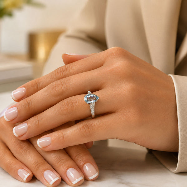 18ct White Gold Pear Cut Aquamarine Ring With Diamond Set Shoulders