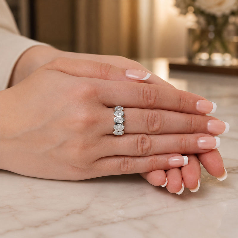 Platinum Oval Cut Diamond Five Stone Rub Over Set Eternity Ring