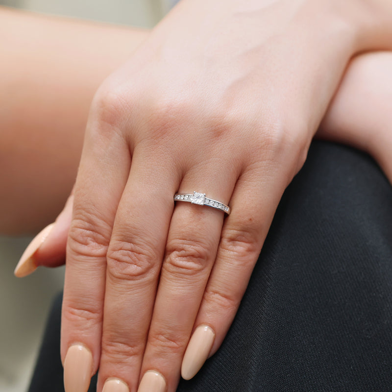 Berry's Platinum Princess Cut Diamond Single Stone Claw Set Ring With Round Brilliant Cut Channel Set Shoulders - Berry's Jewellers