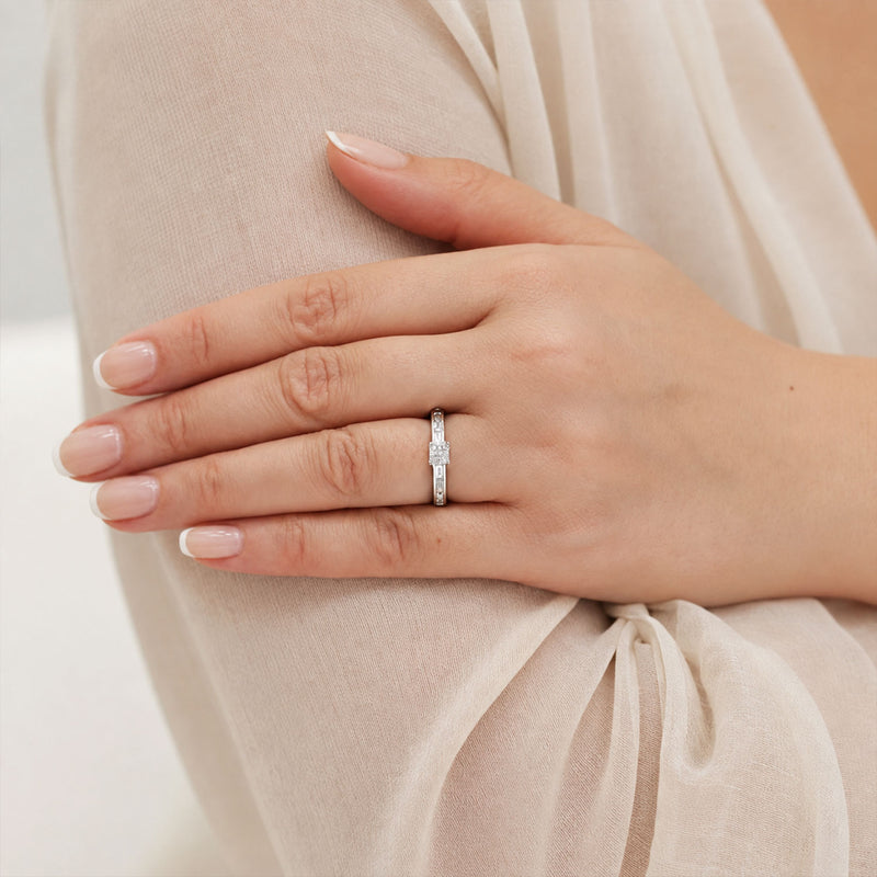 18ct White Gold Four Princess Cut Diamond Cluster Ring With Baguette Cut Diamond Channel Set Shoulders