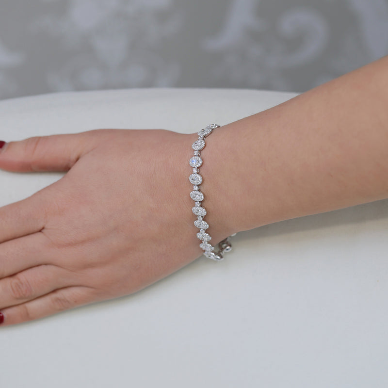 Berry's 18ct White Gold Oval And Round Brilliant Cut Diamond Halo Tennis Bracelet - Berry's Jewellers
