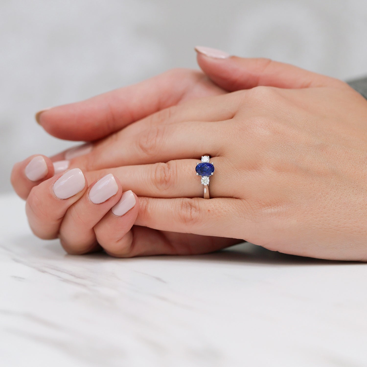 Berry's Platinum Oval Blue Sapphire & Round Brilliant Cut Diamond Three Stone Ring - Berry's Jewellers