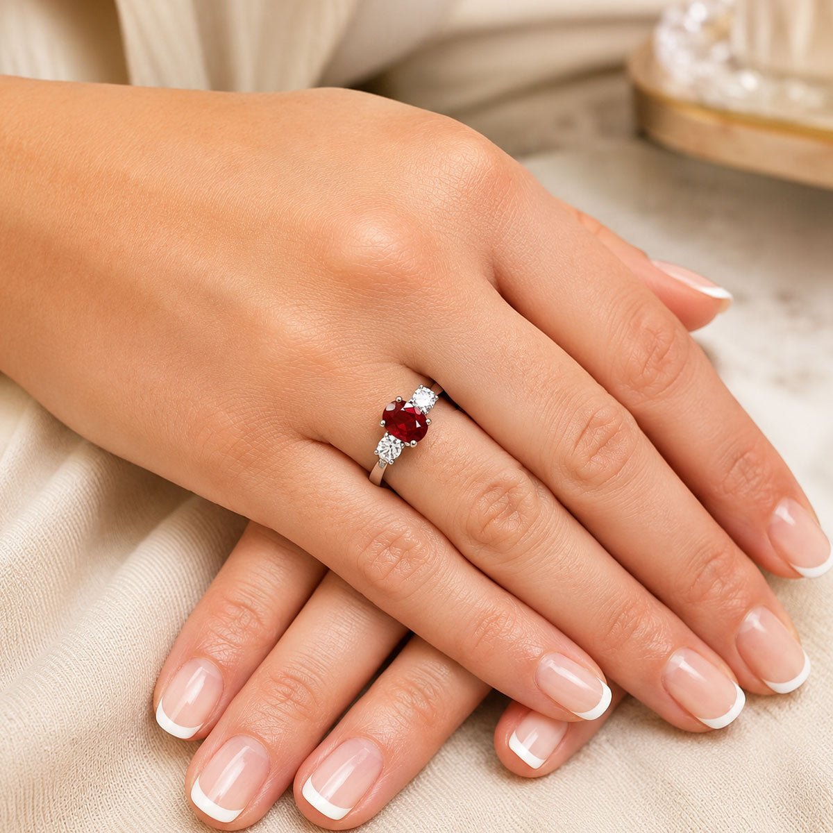 Platinum Oval Cut Ruby And Diamond Three Stone Ring