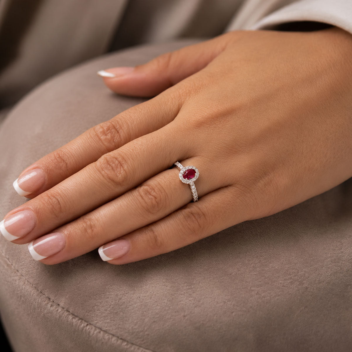 Platinum Oval Cut Ruby In a Diamond Halo Setting With Diamond Set Shoulders