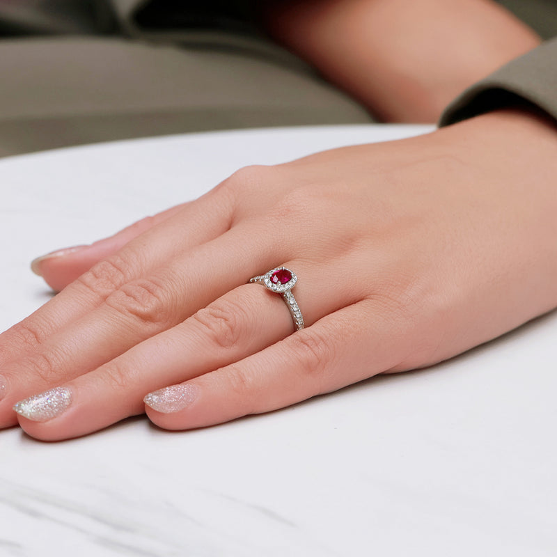 Berry's Platinum Oval Cut Ruby In a Diamond Halo Setting With Diamond Set Shoulders - Berry's Jewellers