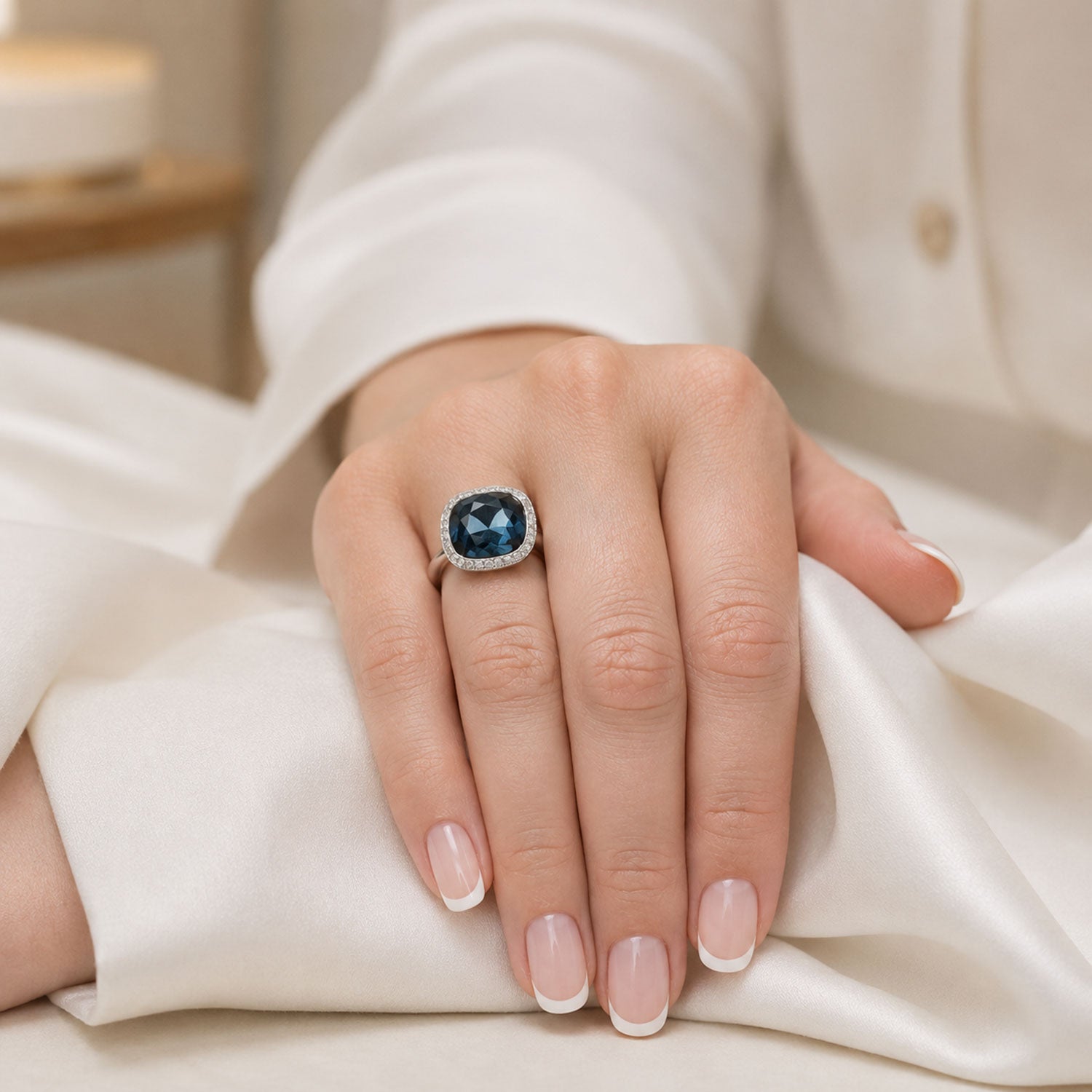 18ct White Gold London Blue Topaz Fancy Ring With A Round Brilliant Cut Halo Surround