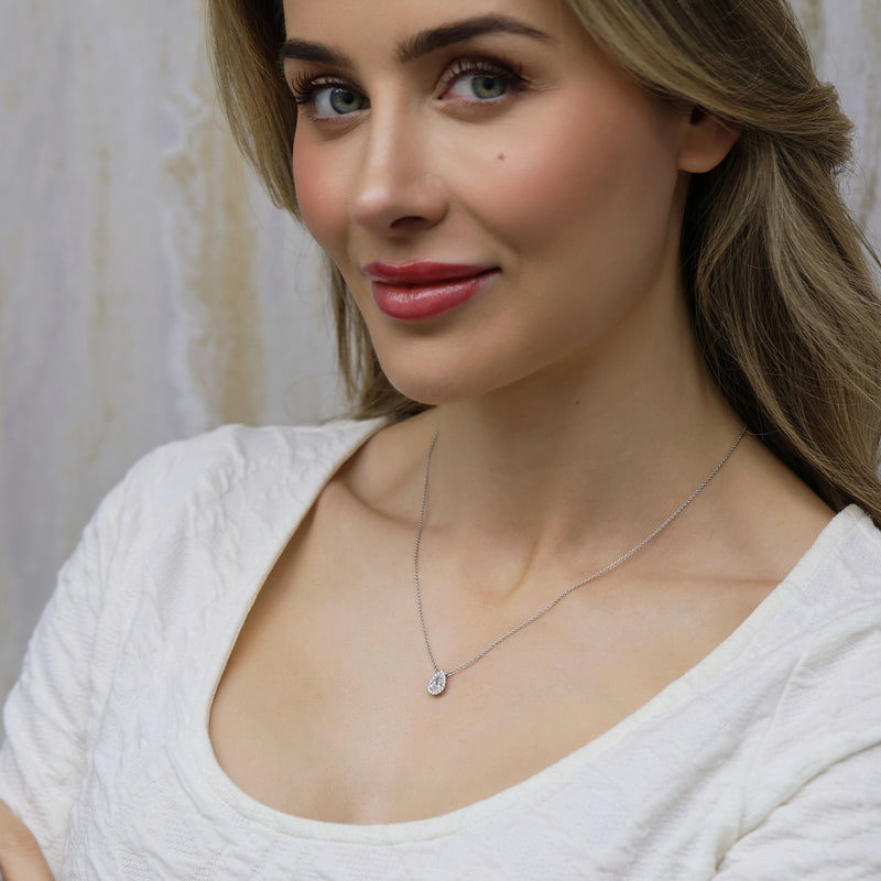 18ct White Gold Pear Cut Diamond 0.80ct Rub Over Halo Pendant
