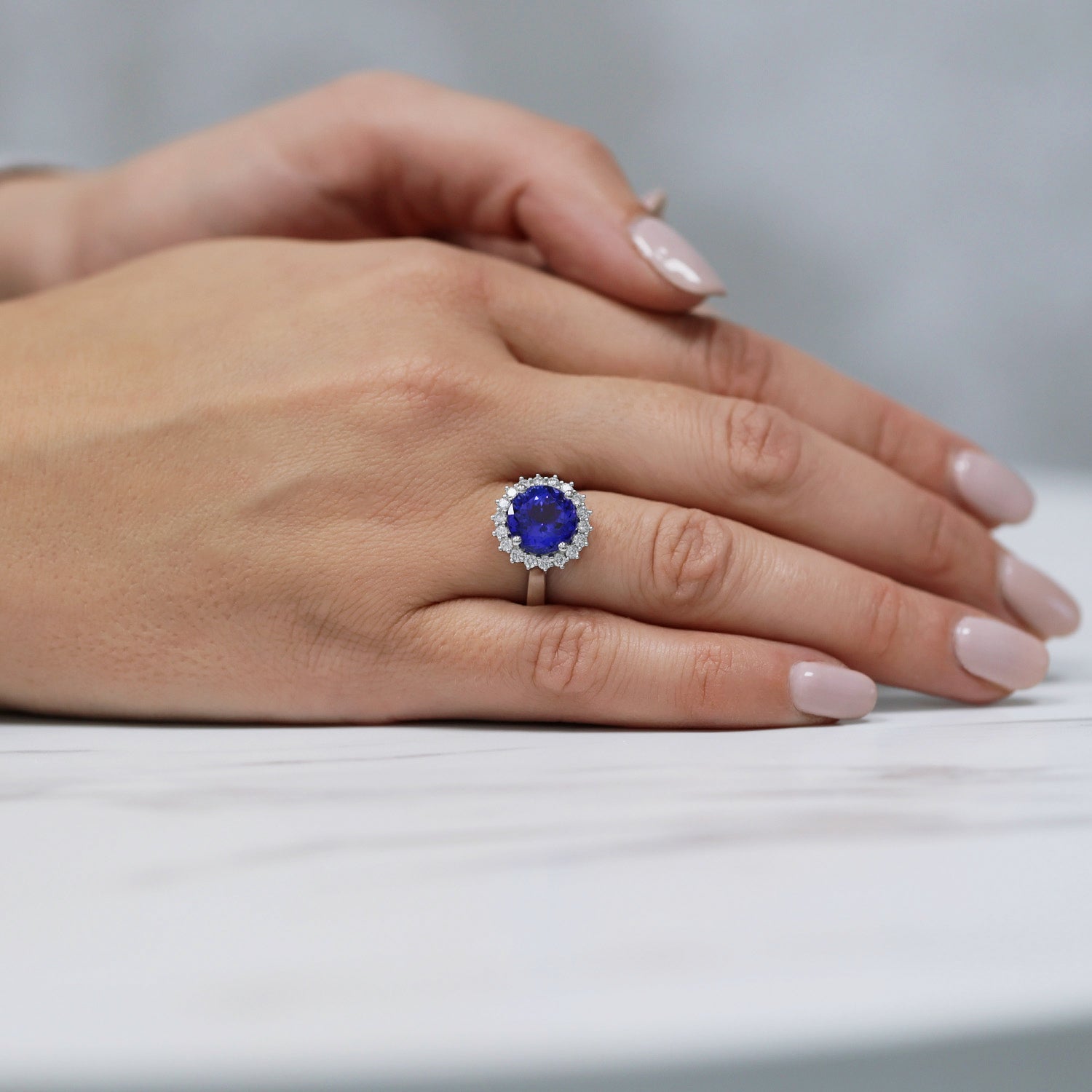 Platinum Round Tanzanite And Diamond Claw Set Cluster Ring
