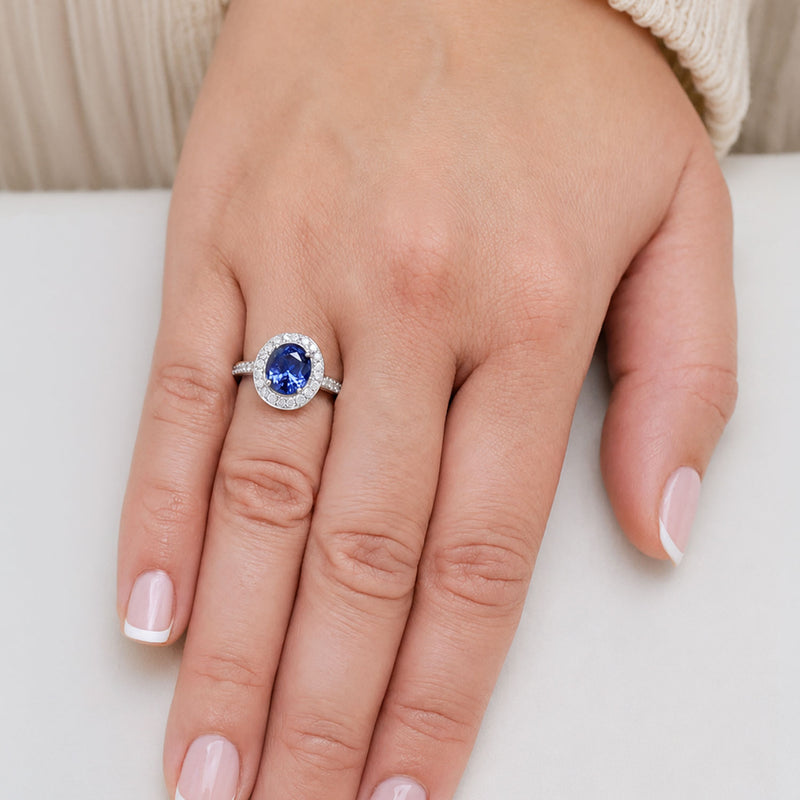 Platinum Oval Sapphire And Diamond Grain Set Halo Cluster Ring With Diamond Shoulders