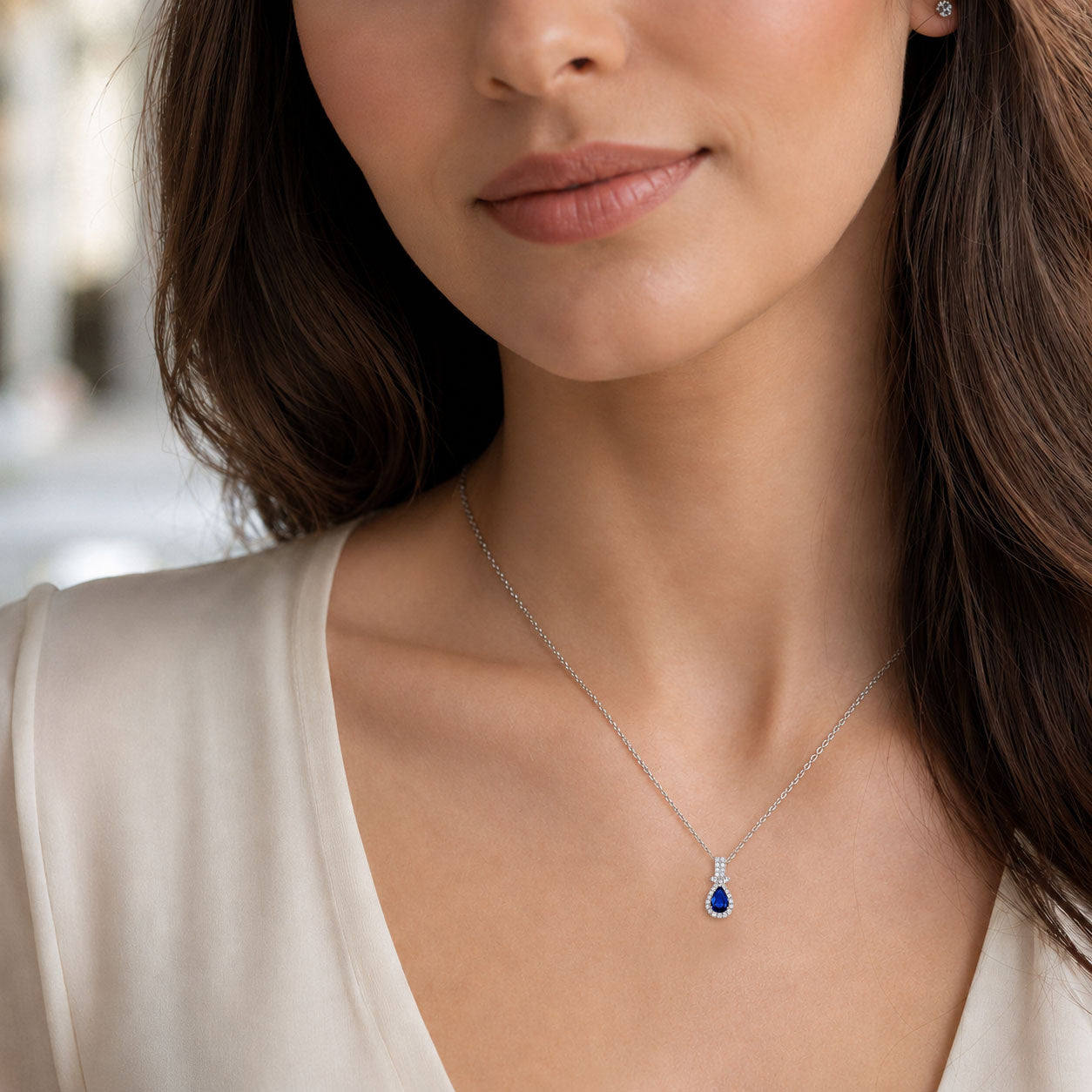 18ct White Gold Pear Shape Blue Sapphire & Round Brilliant Cut Diamond Halo Pendant