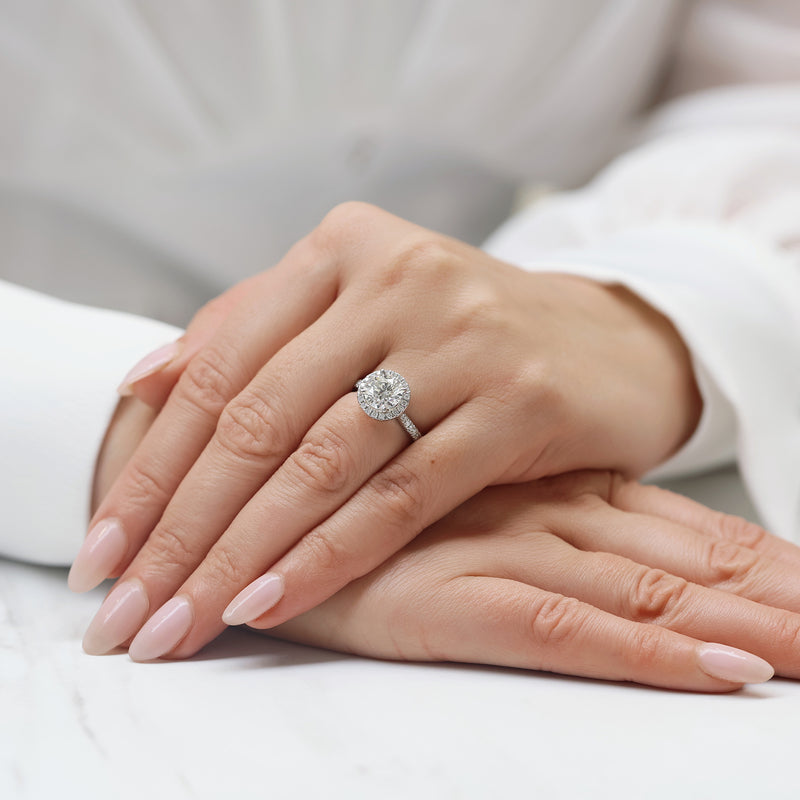 Platinum GIA Certificated Round Brilliant Cut Diamond Halo Ring and Diamond Set Shoulders