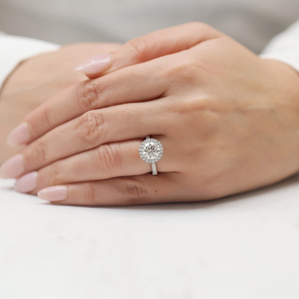 Platinum GIA Certificated Round Brilliant Cut Diamond Halo Ring and Diamond Set Shoulders